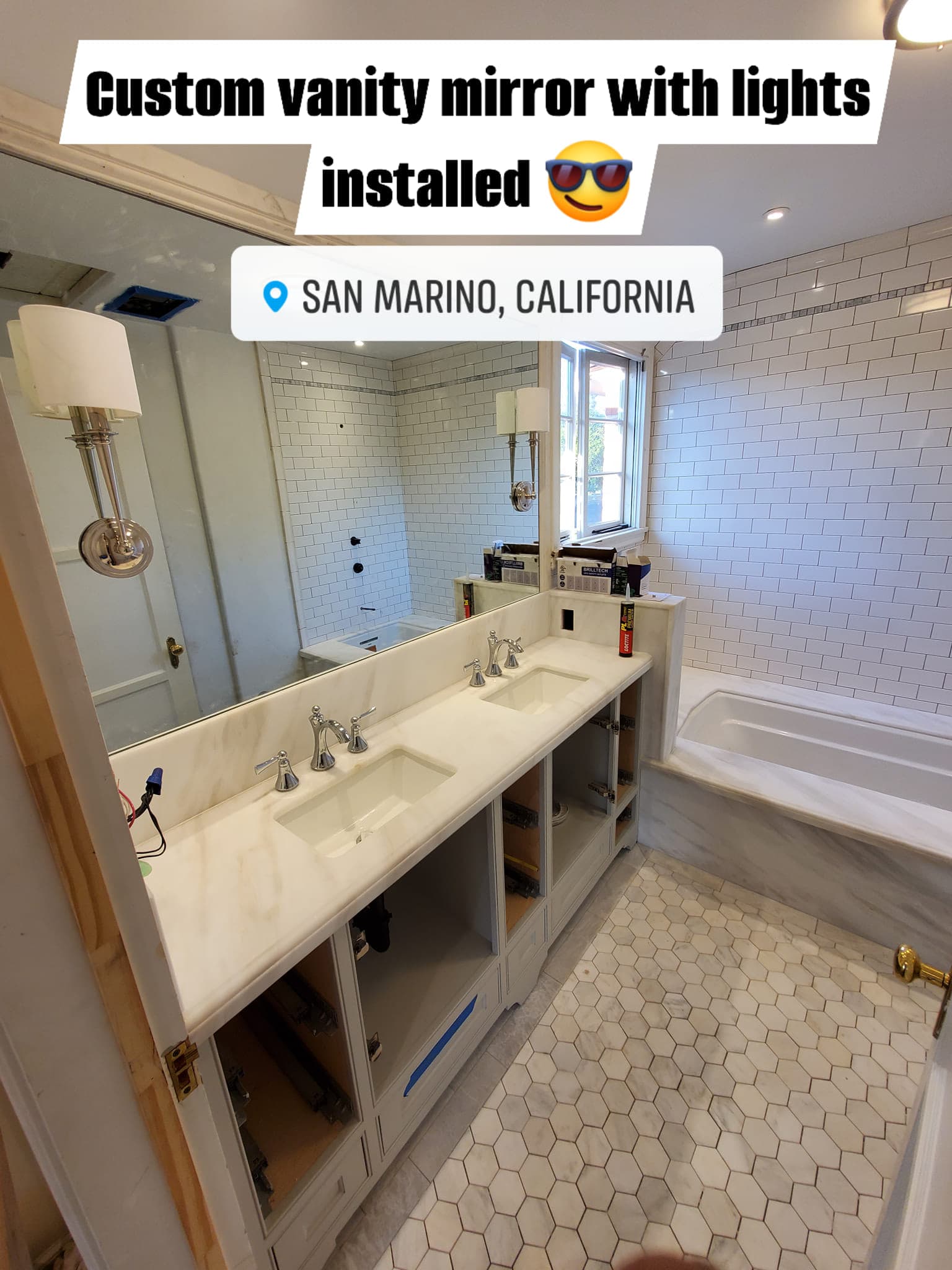 Finished marble double-vanity bathroom in San Marino