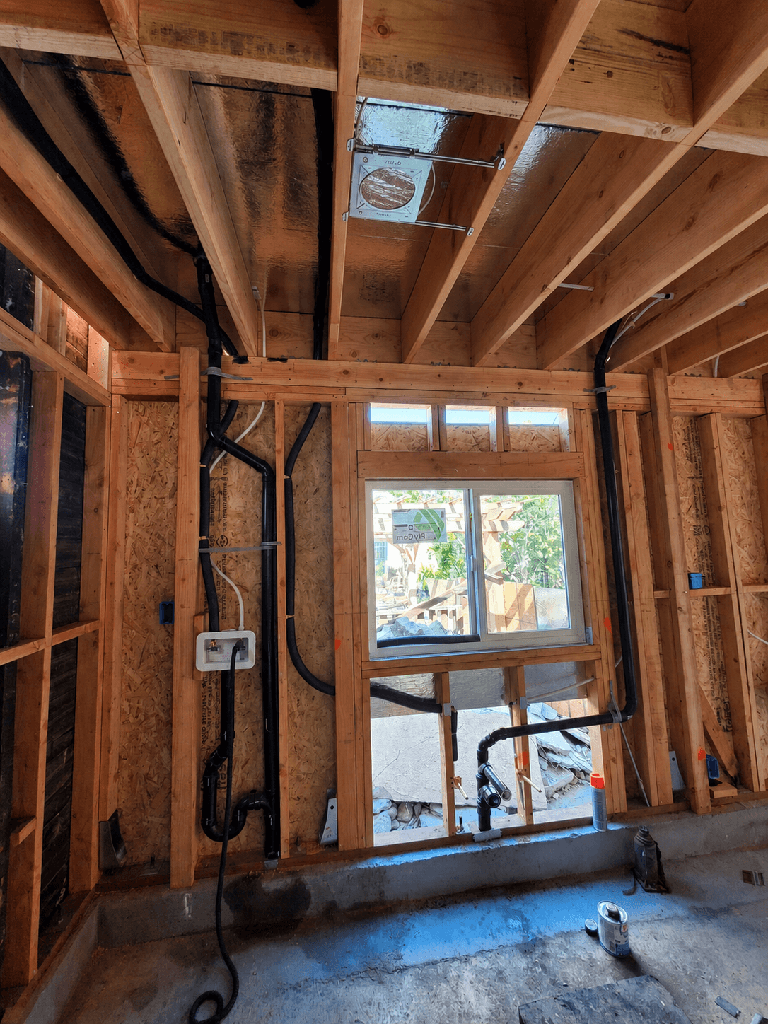 Interior framing with window light after passing structural inspection